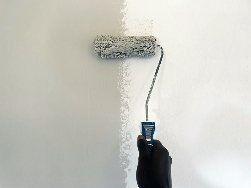 Interior wall being rolled after preparation